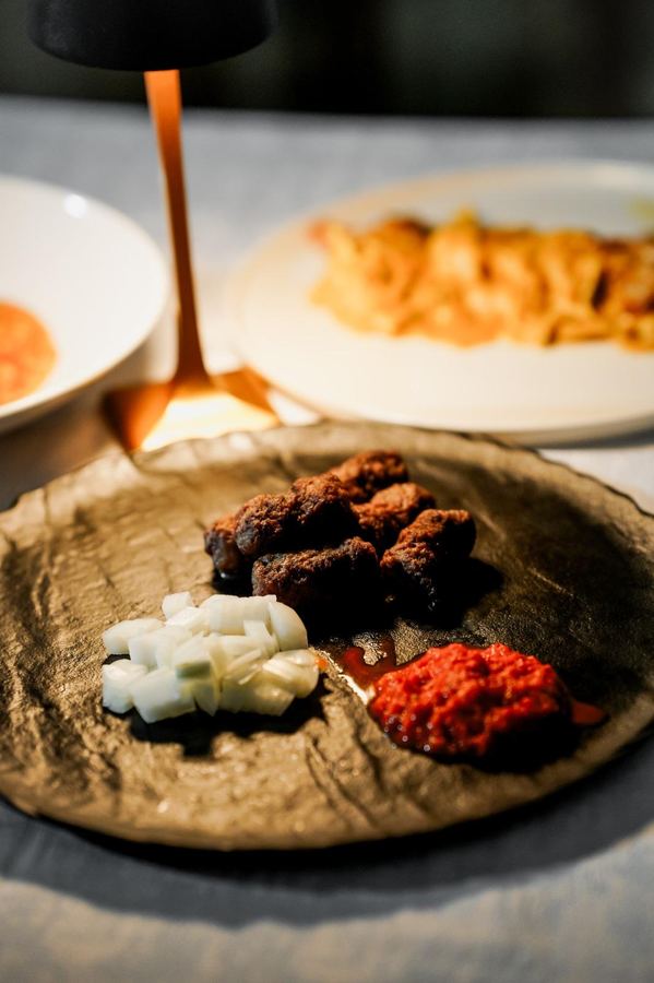 Handmade ćevapi with onion and ajvar at Monaco